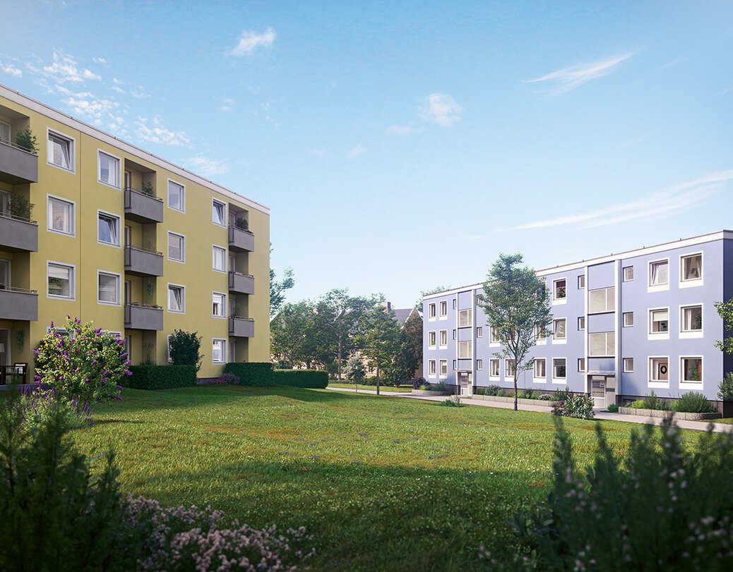 Zwei Wohnkomplexe mit Balkonen gelegen an Grünanlage