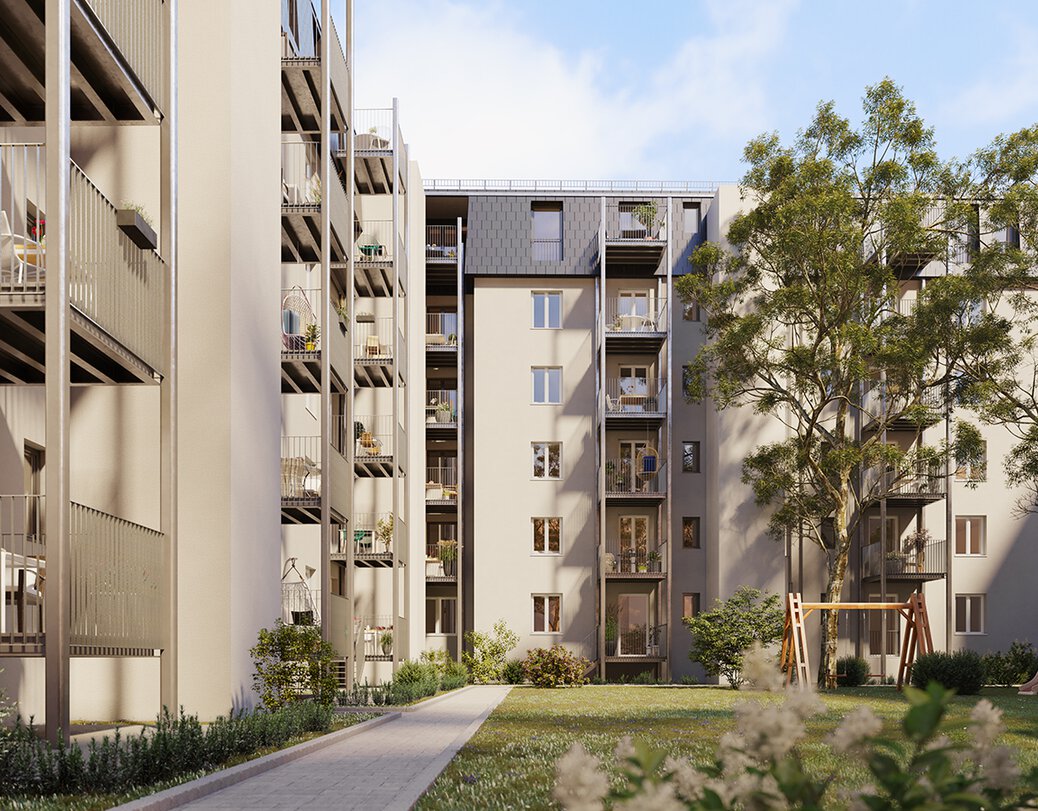 Ansicht des Innenhofs mit Wiese und Spielplatz des Wohnobjekts in der Rheinstraße/Mainzerstraße. IDer Innenhof ist umgeben von dem modernen 5 stöckigen Wohngebäude mit angebauten Balkonen