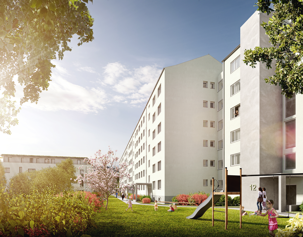 Außenansicht des Wohnquartiers an der Gärtnerei mit Grünanlage und Spielplatz vor den Wohnungseingängen